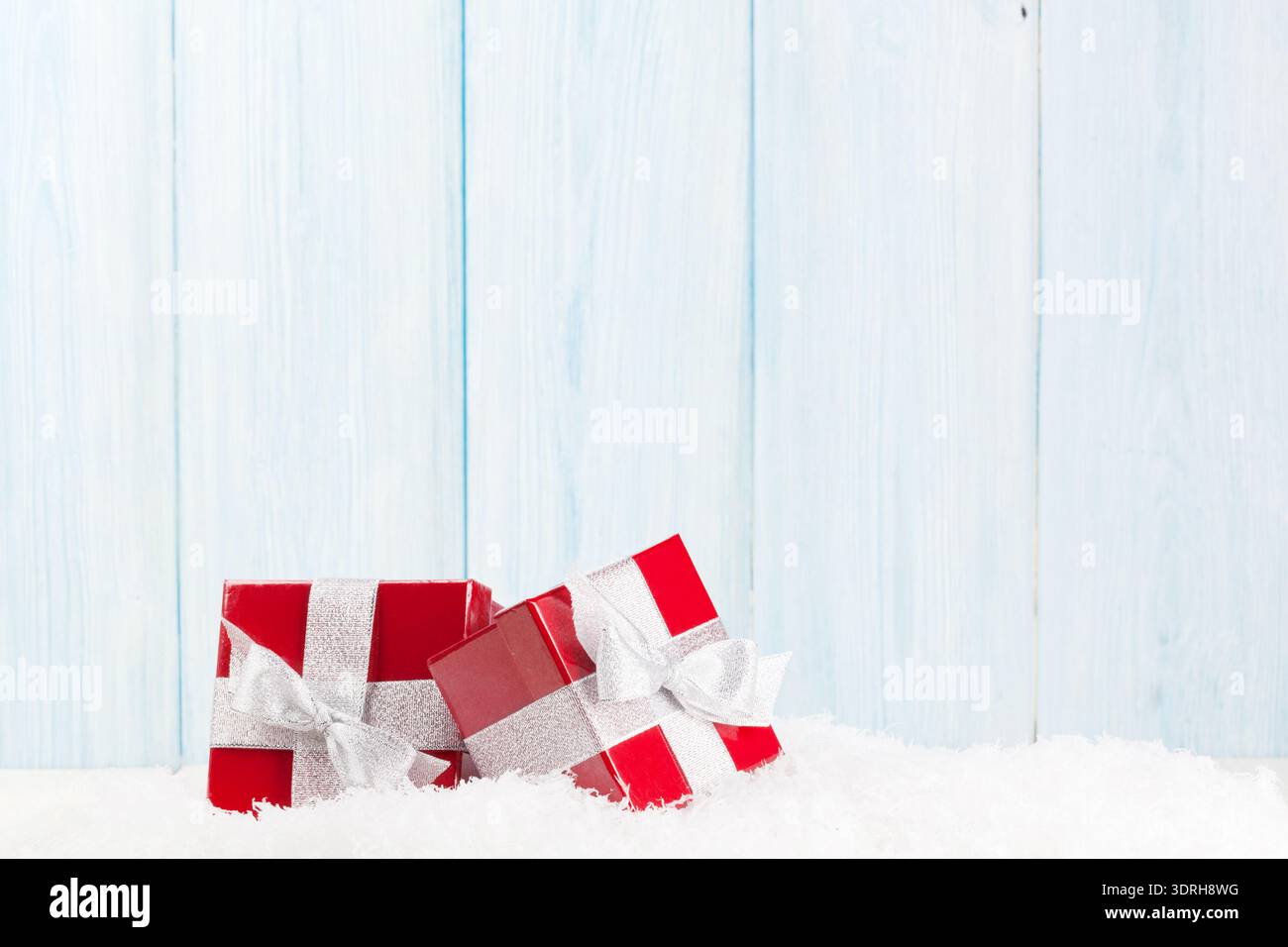 Christmas gift boxes in snow Stock Photo