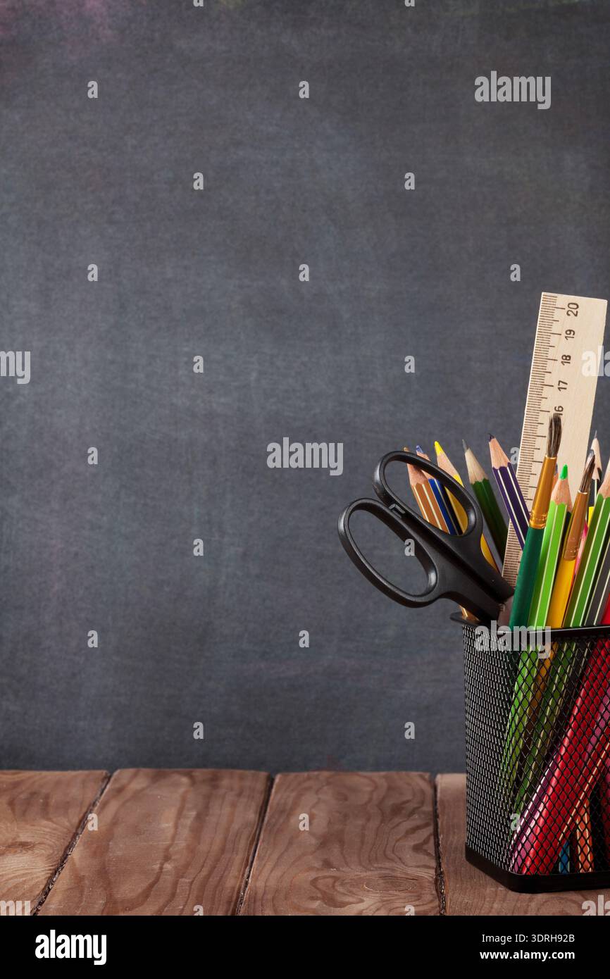 School and office supplies on classroom table Stock Photo