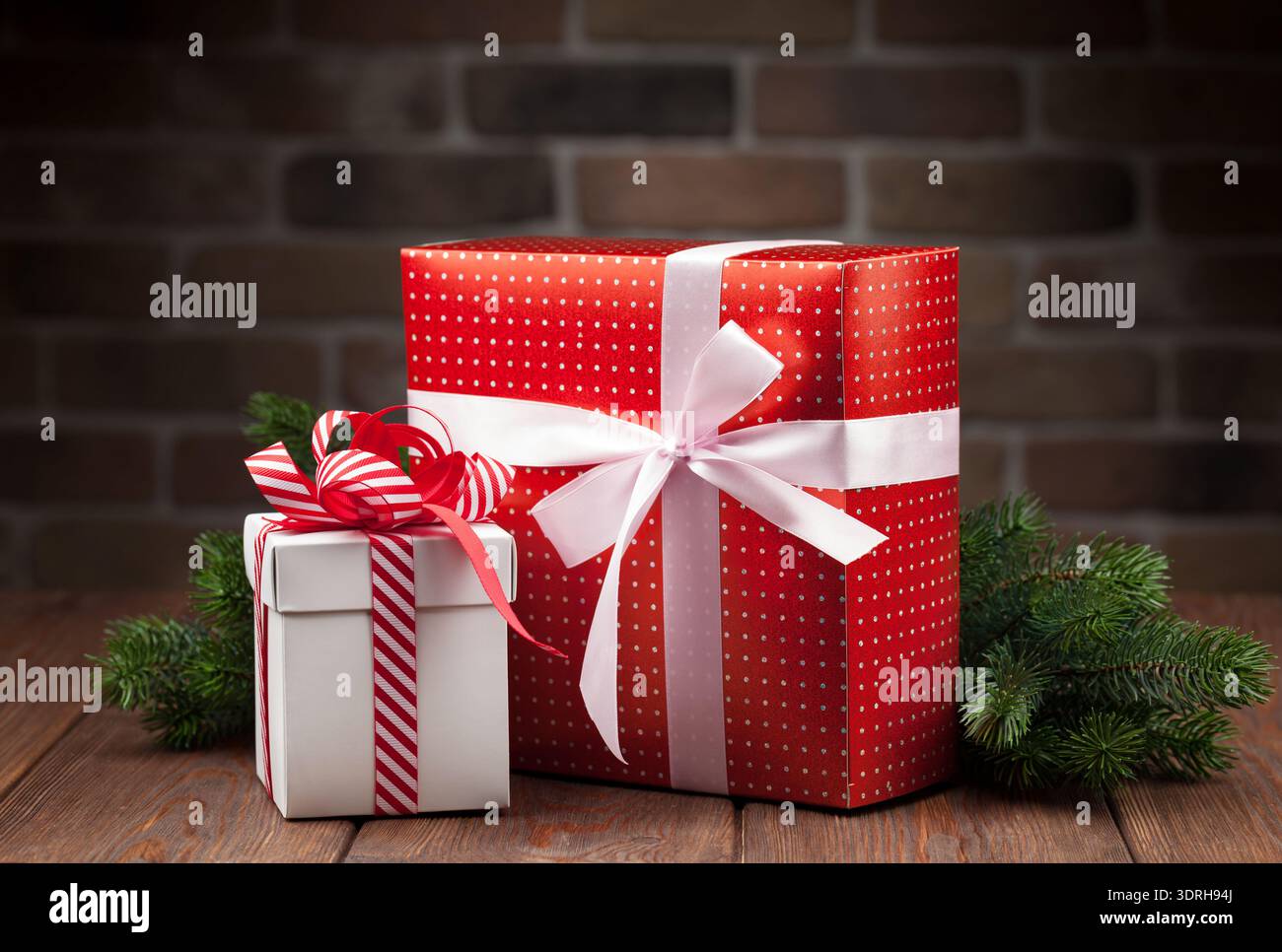 Christmas gift boxes and tree branch Stock Photo