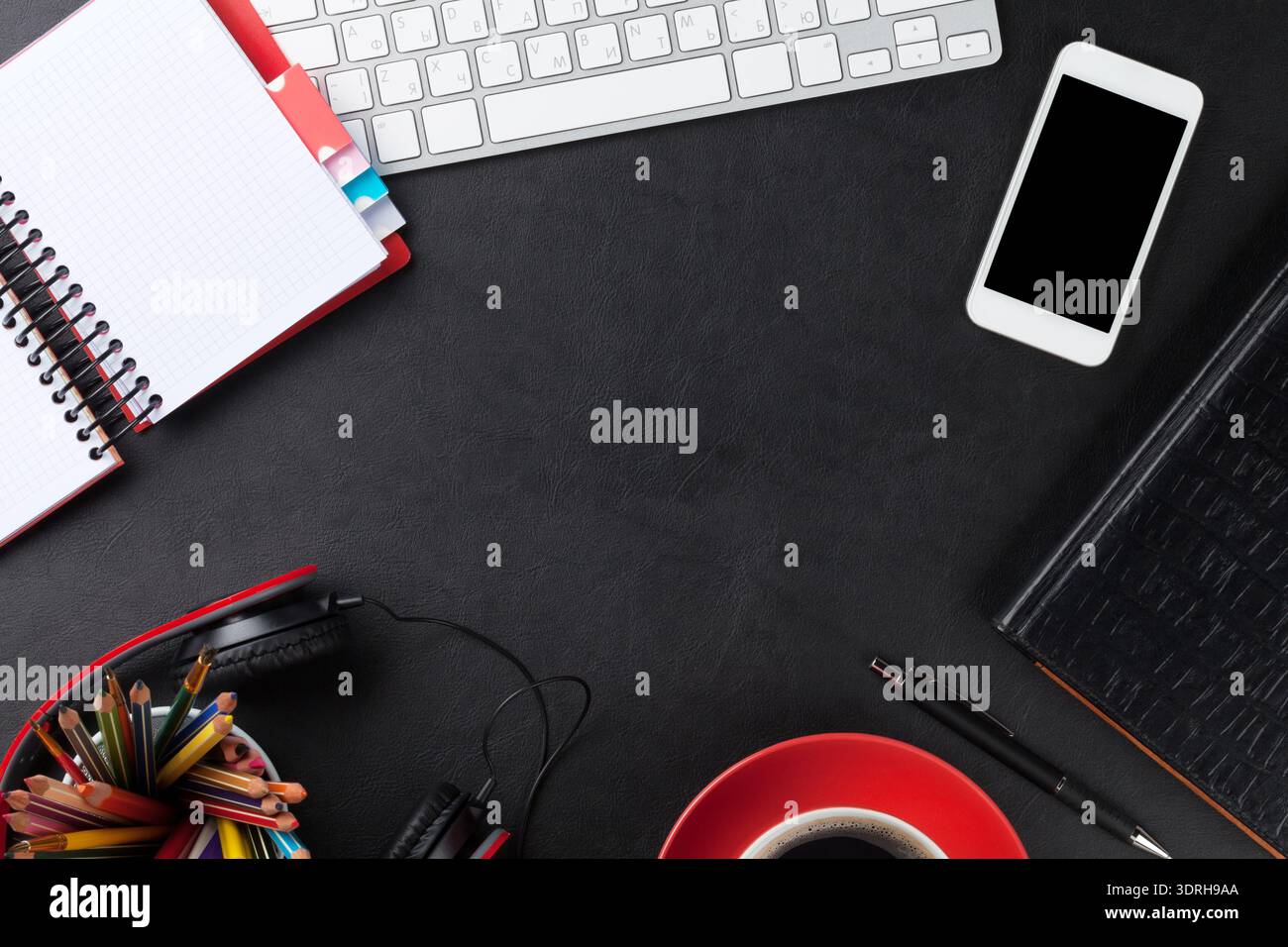 Office leather desk with pc and supplies Stock Photo