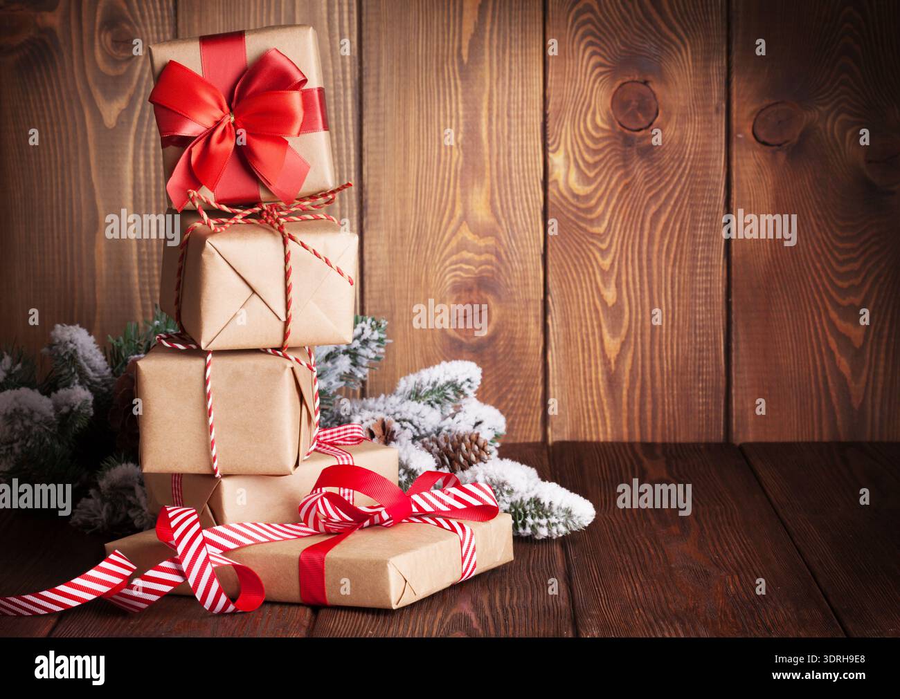 Christmas gift boxes and tree branch Stock Photo