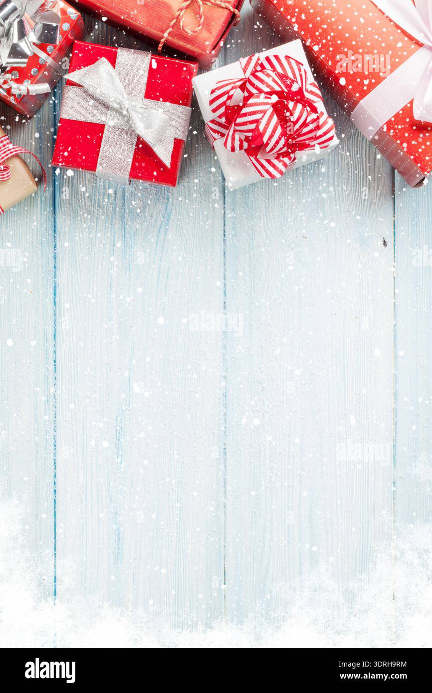 Christmas gift boxes on wooden table Stock Photo