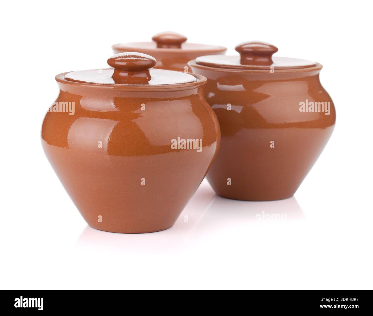 Three clay pots. Isolated on white background Stock Photo