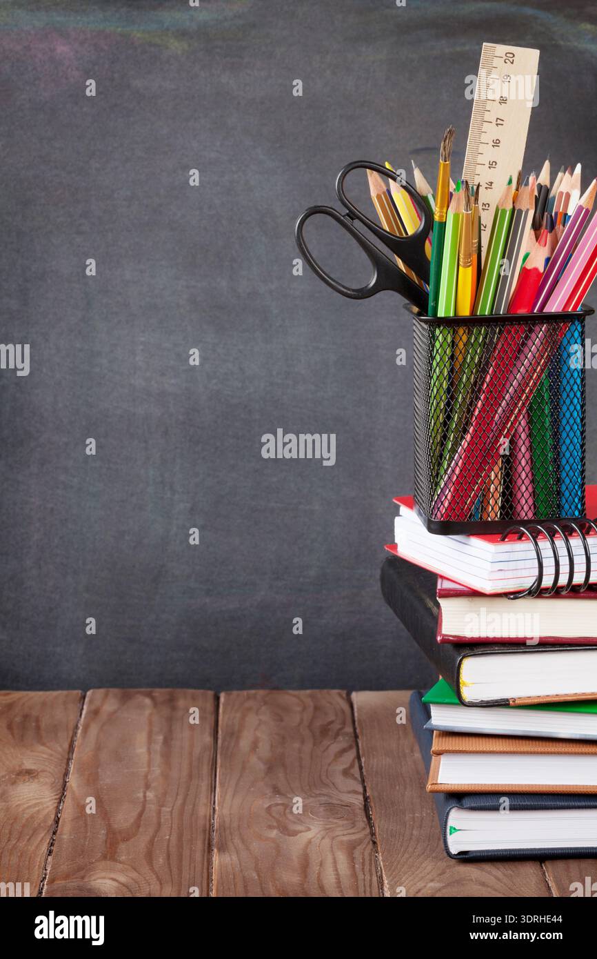 School and office supplies on classroom table Stock Photo