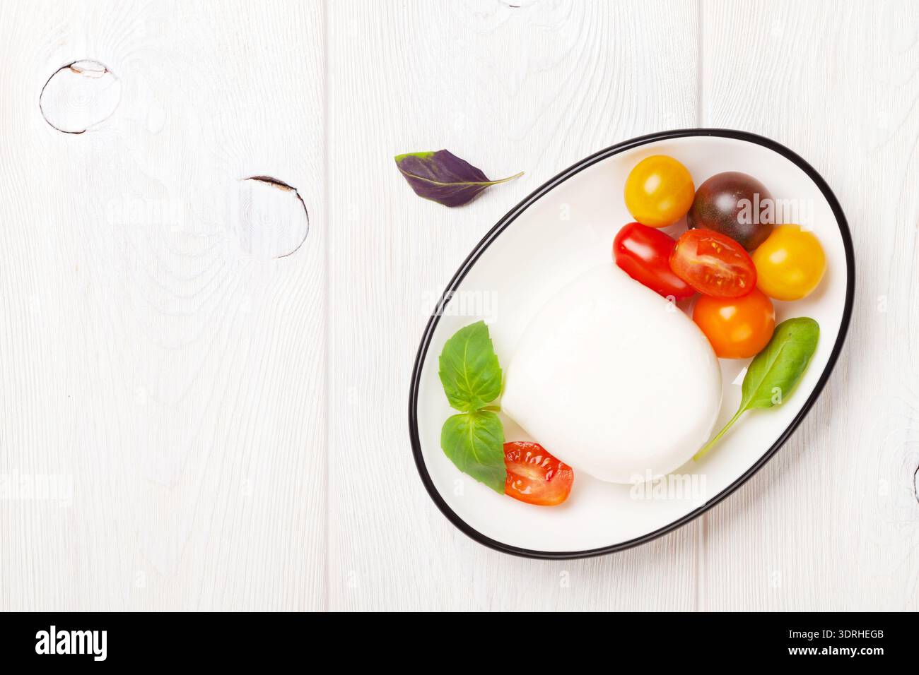 Mozzarella, tomatoes and basil Stock Photo