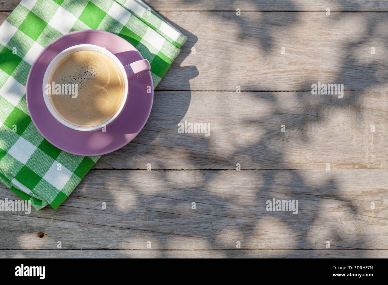 Coffee cup on garden table Stock Photo
