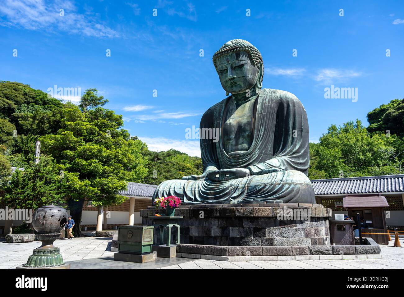 The Great Buddha of Kamakura (Daibutsu) with stone lantern in