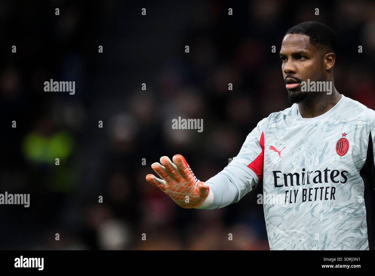 Mike Maignan of AC Milan gestures during the Serie A football match ...