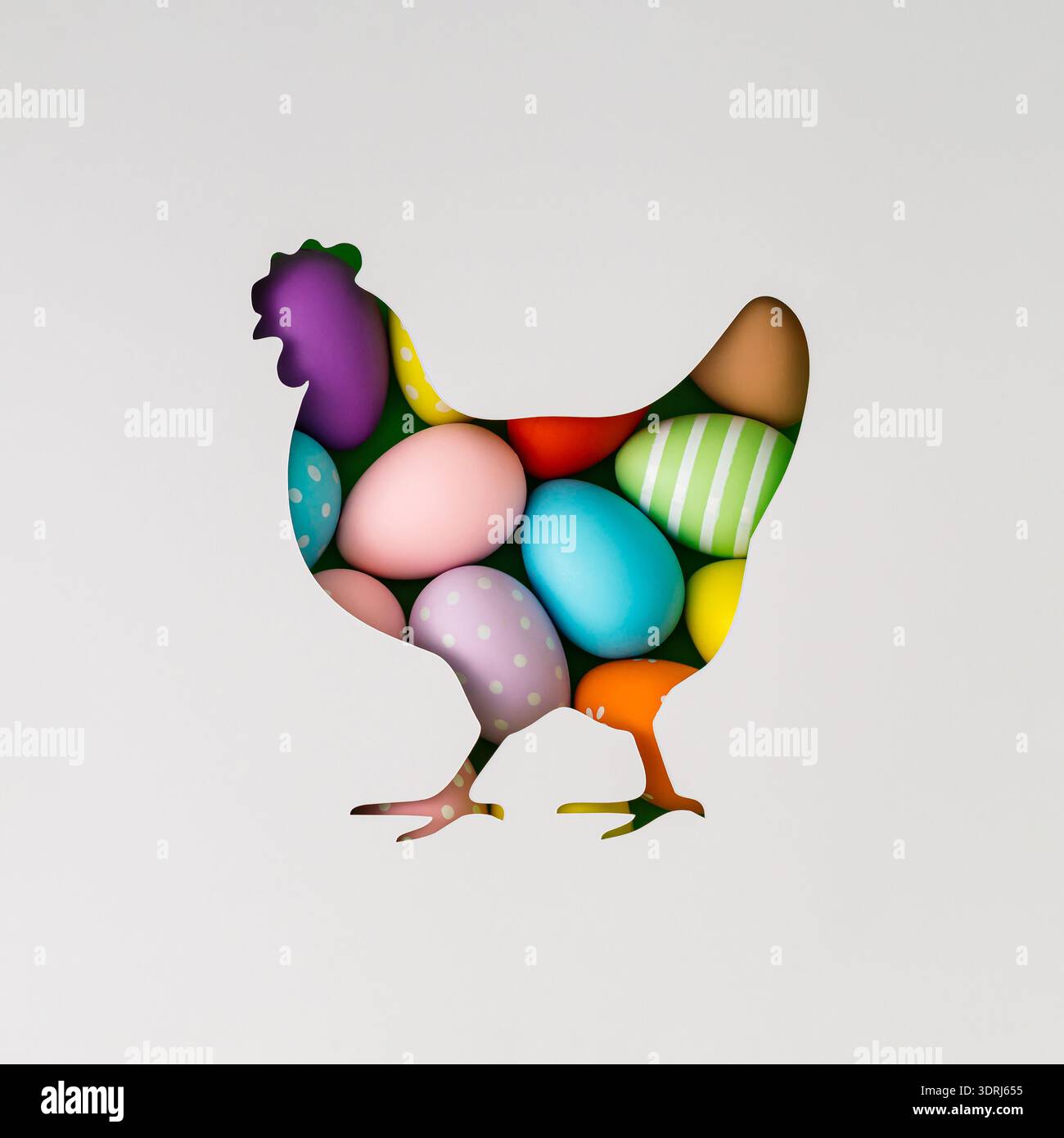 Spring composition with chicken silhouette paper cutout filled with colored Easter eggs on white background. Minimal Easter concept. Stock Photo