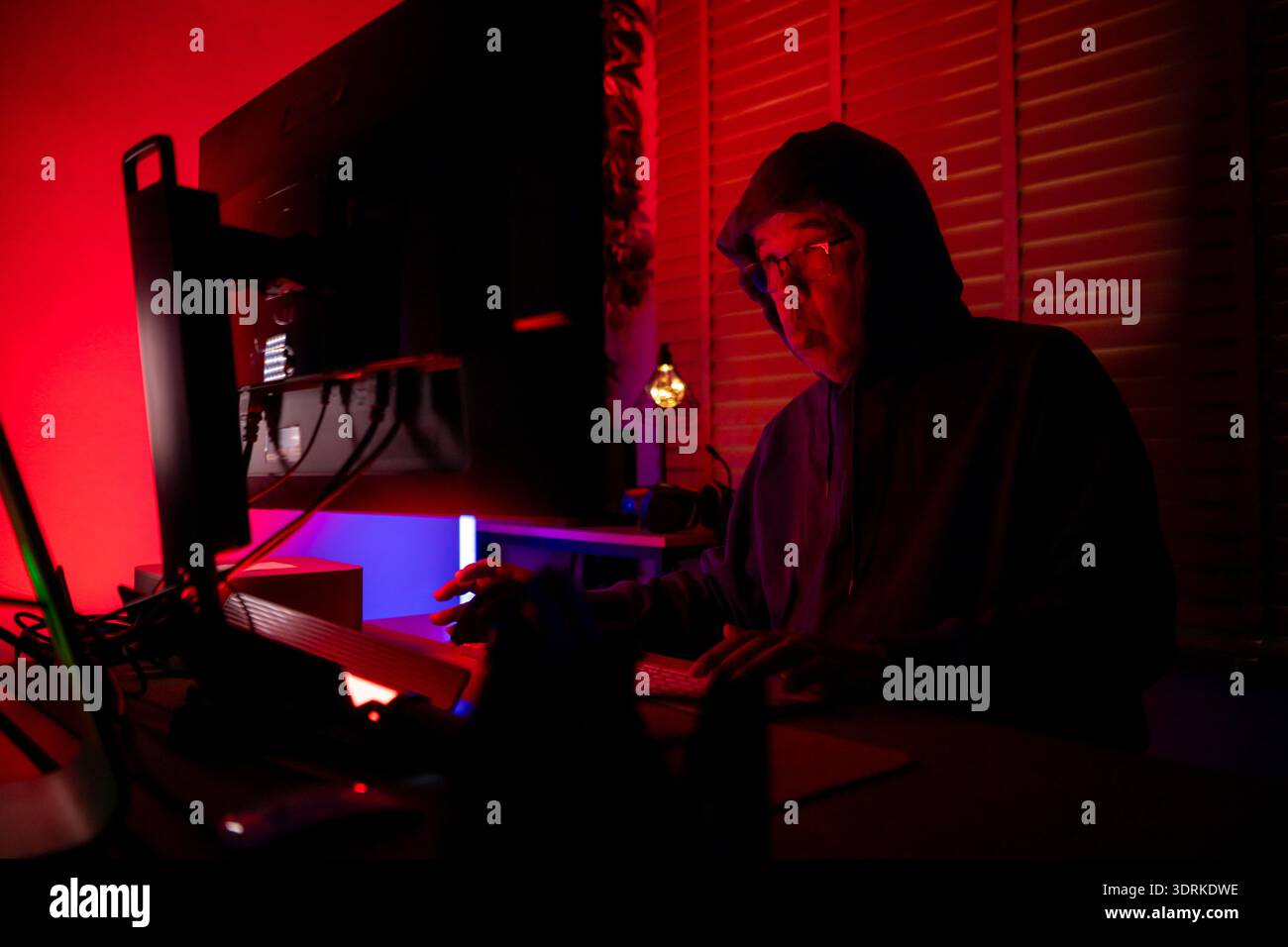 An expert hacker is decrypting data Stock Photo