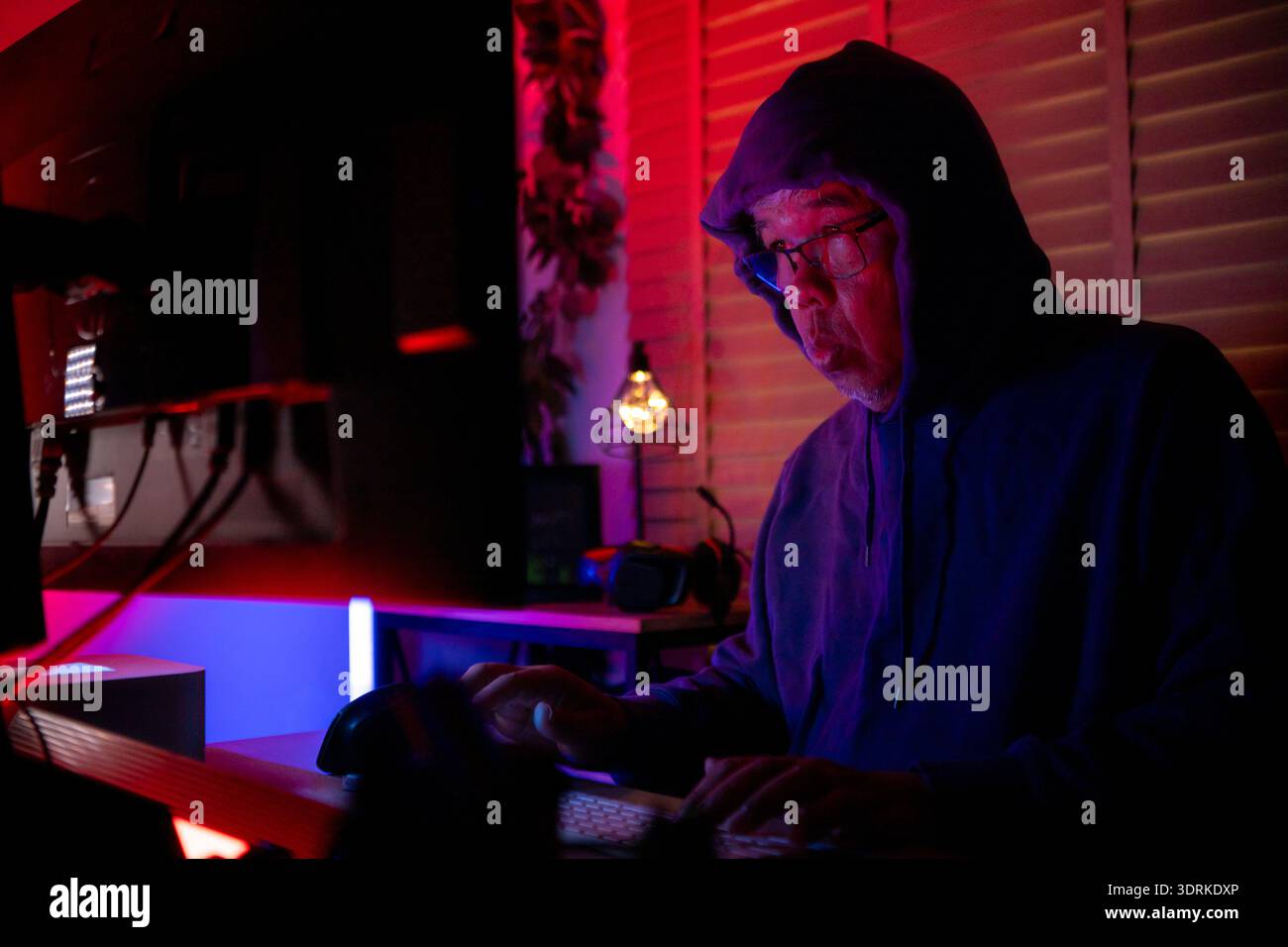 An expert hacker is decrypting data Stock Photo