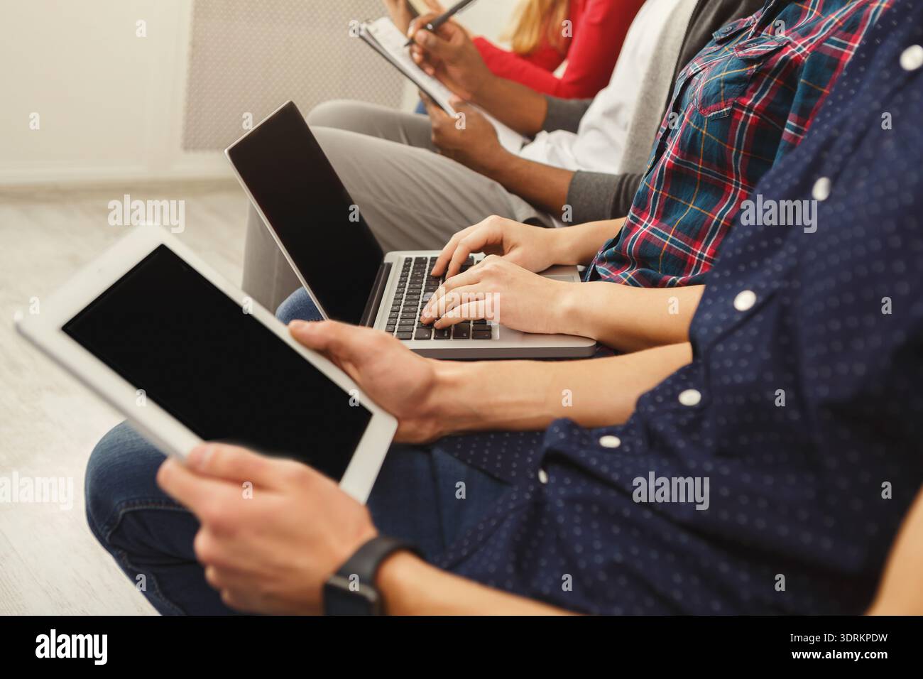Collage of People Using Devices in a Setting Focused on Technology and Communication Stock Photo