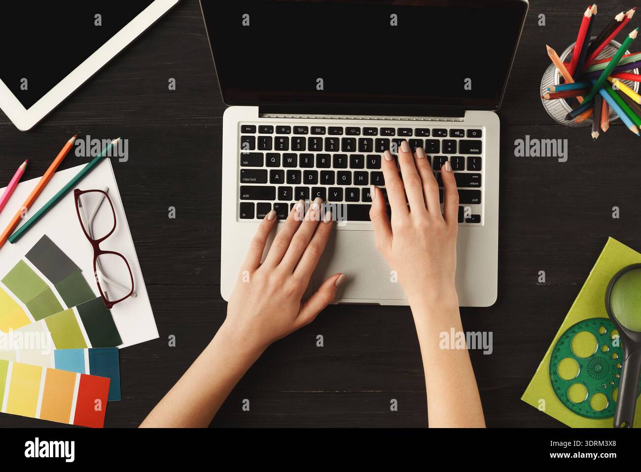 Creative Workspace Featuring Tools for Design and Color Selection Stock Photo