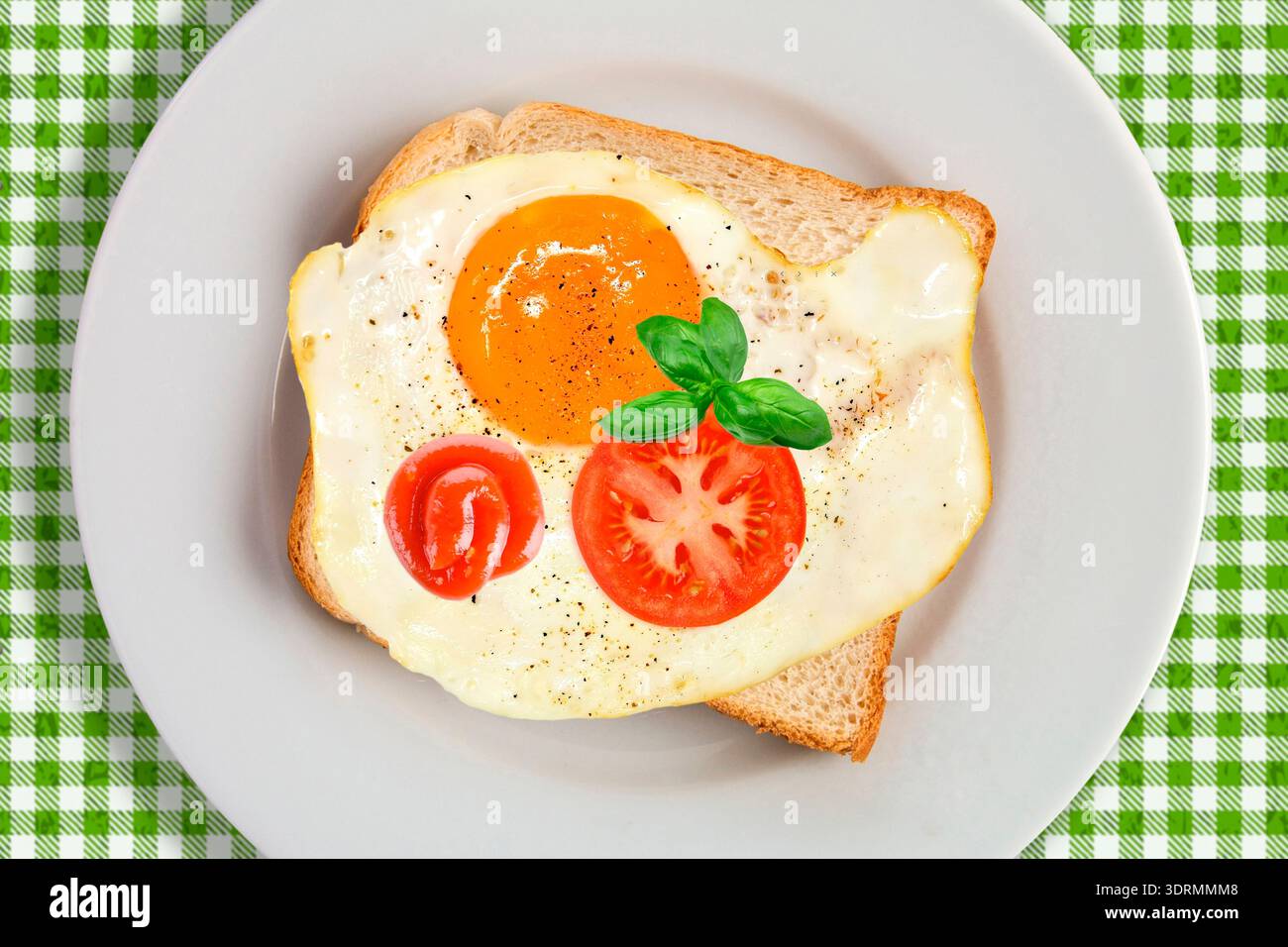 Breakfast with fried egg on toast Stock Photo