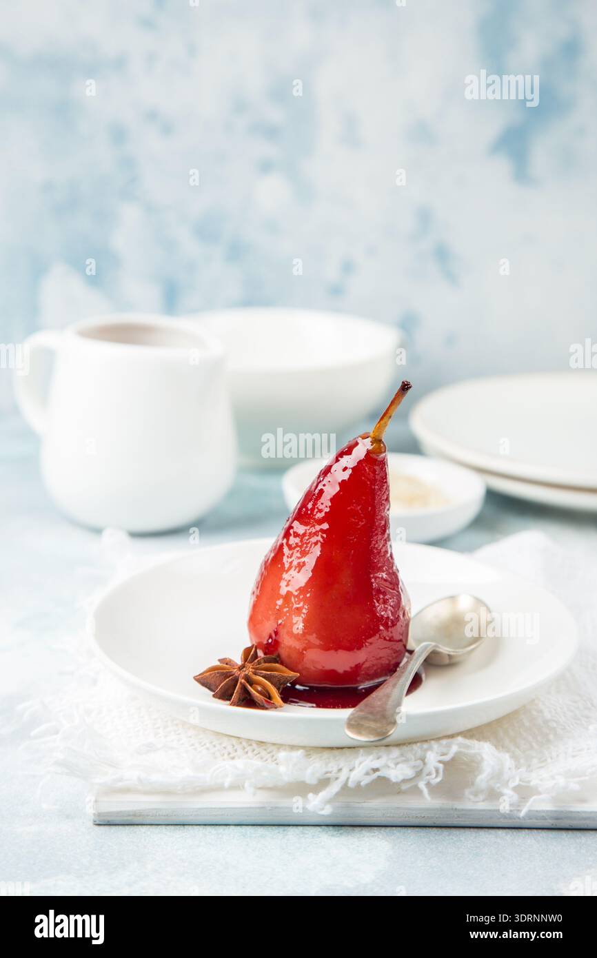 Poached pears in spicy red wine  syrup Stock Photo