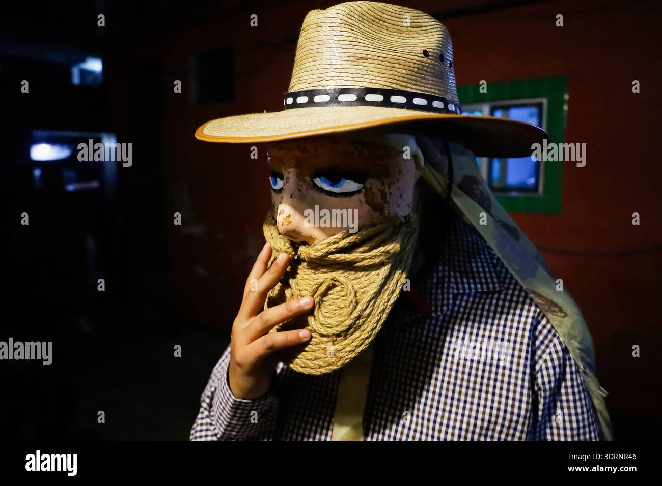 Holy Week Masks A person wearing a mask prepares to participate in the Carnival of ...