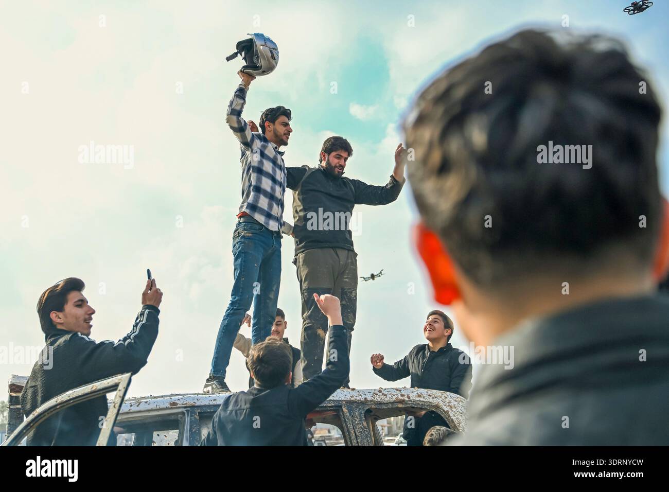 ERBIL, IRAQ. 26 DECEMBER 2025: Team members and fans stand on top of a ...
