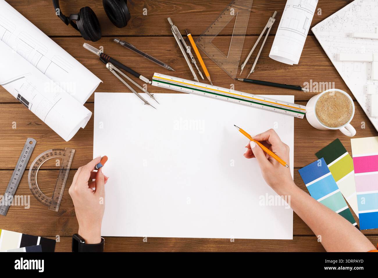 Creative Process Involves Sketching Ideas on Blank Paper With Tools for Design and Planning Stock Photo