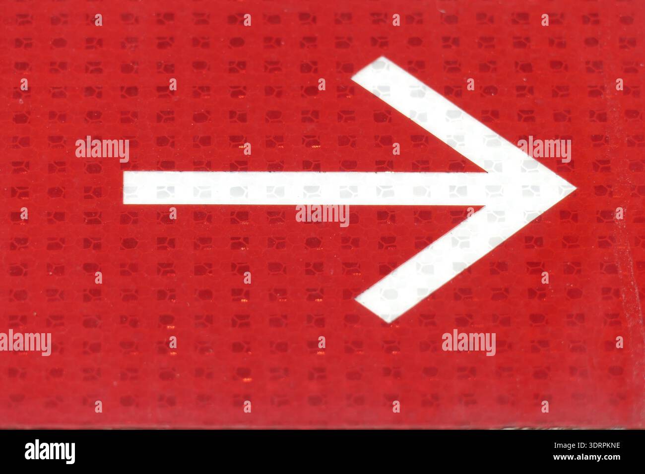 White arrow on red background Stock Photo