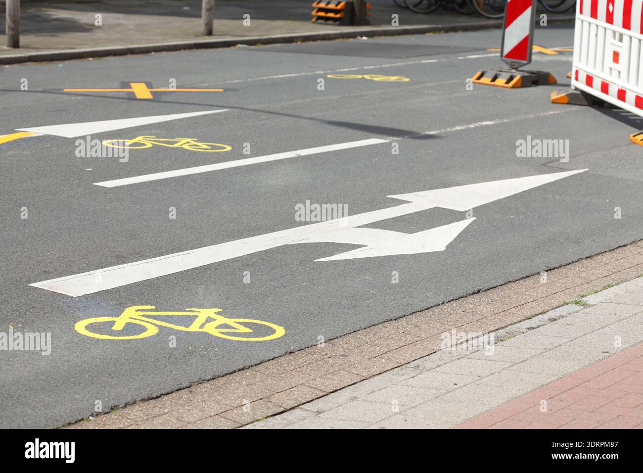 Road marking direction arrow, cycle path, diversion Stock Photo