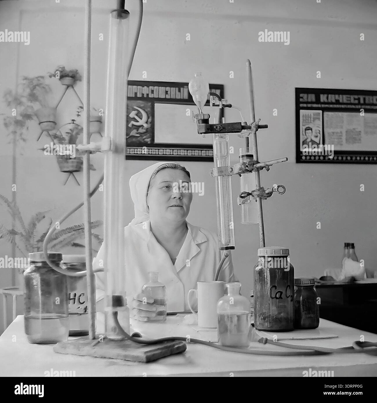 Soviet Testing Lab Historical 1960s black and white photograph showing a female laboratory ...