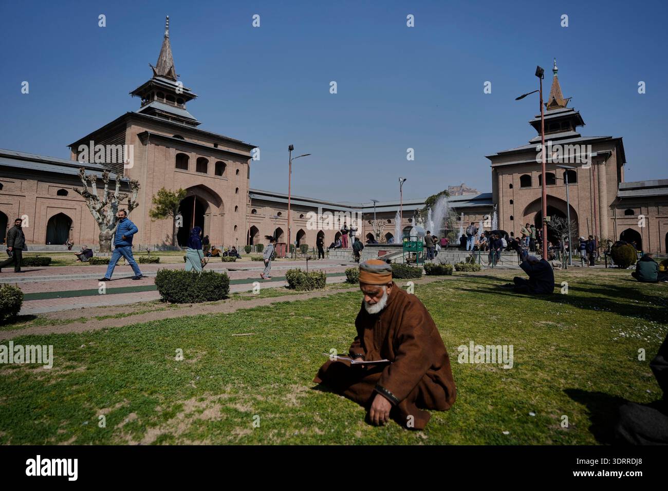An elderly Kashmiri Muslim man reads the Islamic holy book, the Quran ...