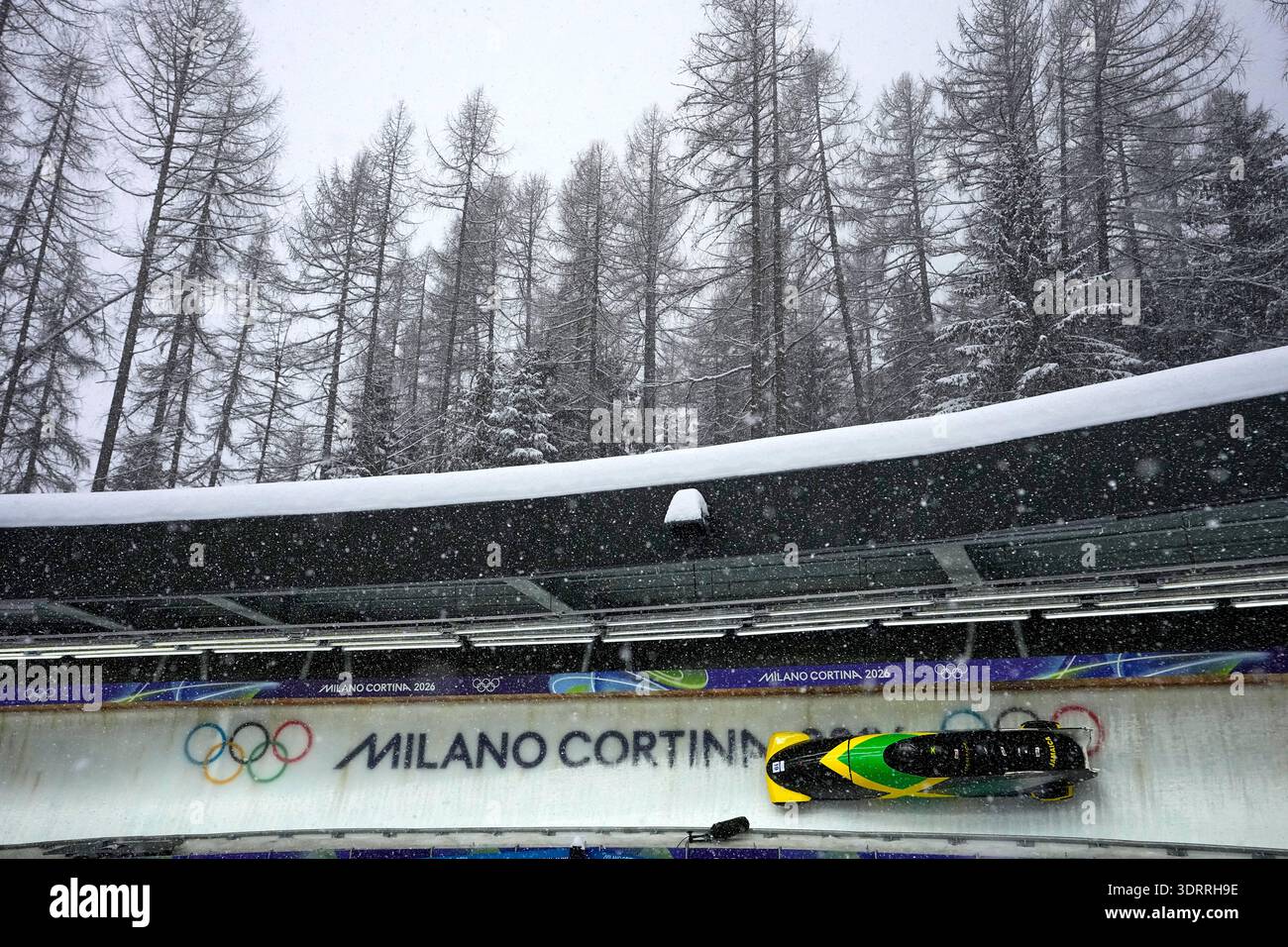 Jamaica's Shane Pitter, left, slides down the track during a four man ...