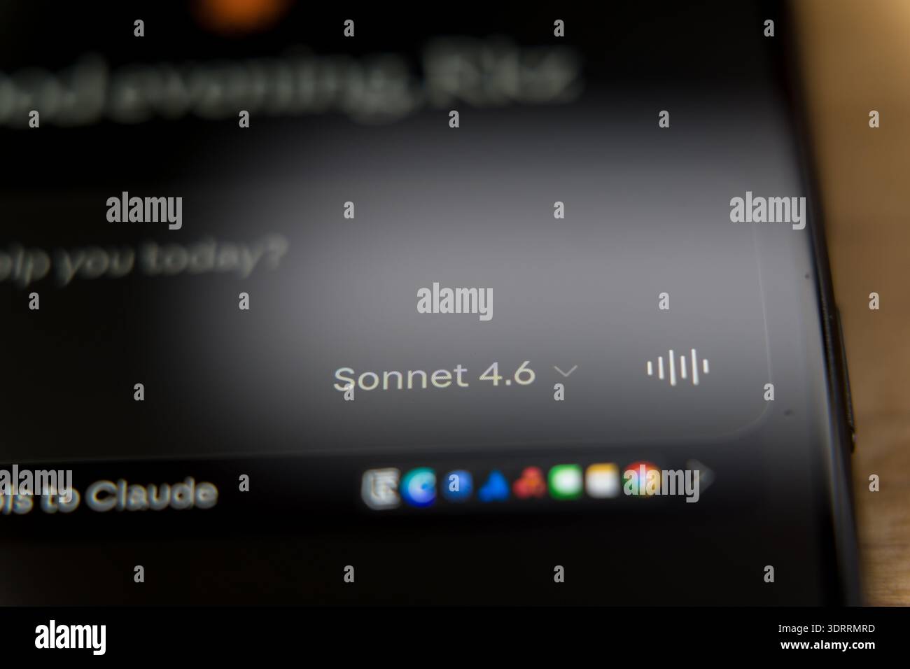 Claude Sonnet 4.6 mobile application interface on a smartphone screen, featuring a personalized greeting and tool access for advanced AI conversationa Stock Photo