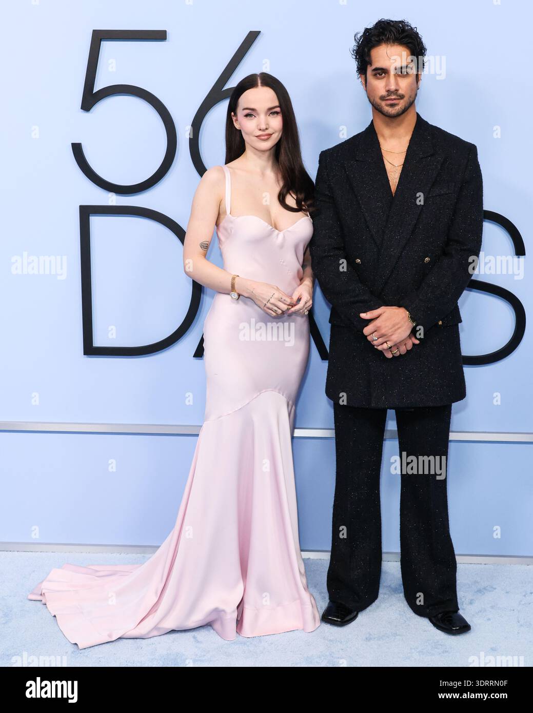 WESTWOOD, LOS ANGELES, CALIFORNIA, USA - FEBRUARY 11: Dove Cameron wearing  a Chopard L'heure Du Diamant Round Watch, Jimmy Choo Liberty Platform  Sandals an a Bernini Custom Engagement Ring and Avan Jogia