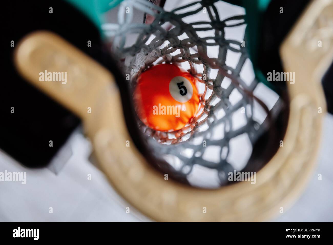 Falling Pool Table Billiard ball falling into pocket on pool table during game close up ...