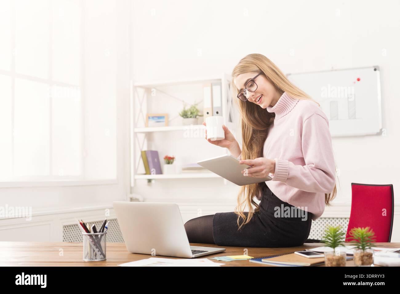 Creative Workspace Collage Featuring a Woman Using a Tablet and Smiling Stock Photo