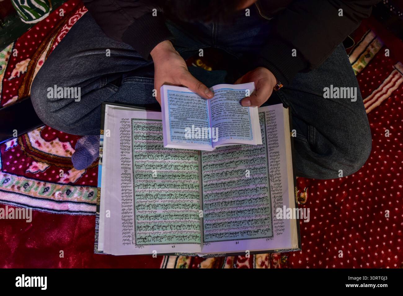 Srinagar, India. 19th Feb, 2026. A Kashmiri Muslim recites the Holy ...