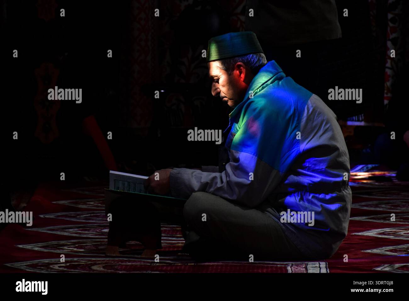 Srinagar, India. 19th Feb, 2026. A Kashmiri Muslim recites the Holy ...