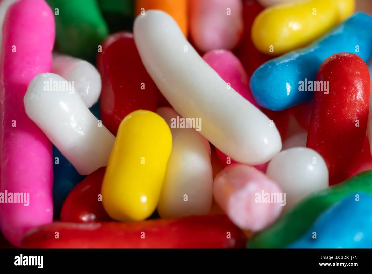 Macro close up of colorful rainbow sprinkles candy texture background Stock Photo