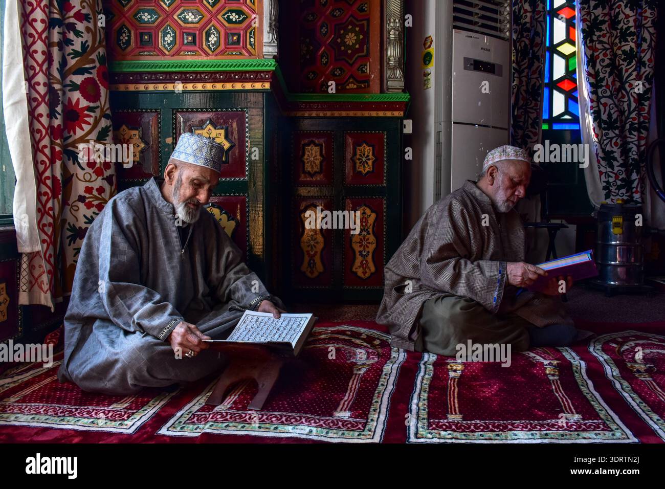 Kashmiri Muslim men recite the Holy Quran inside the shrine of Syed ...