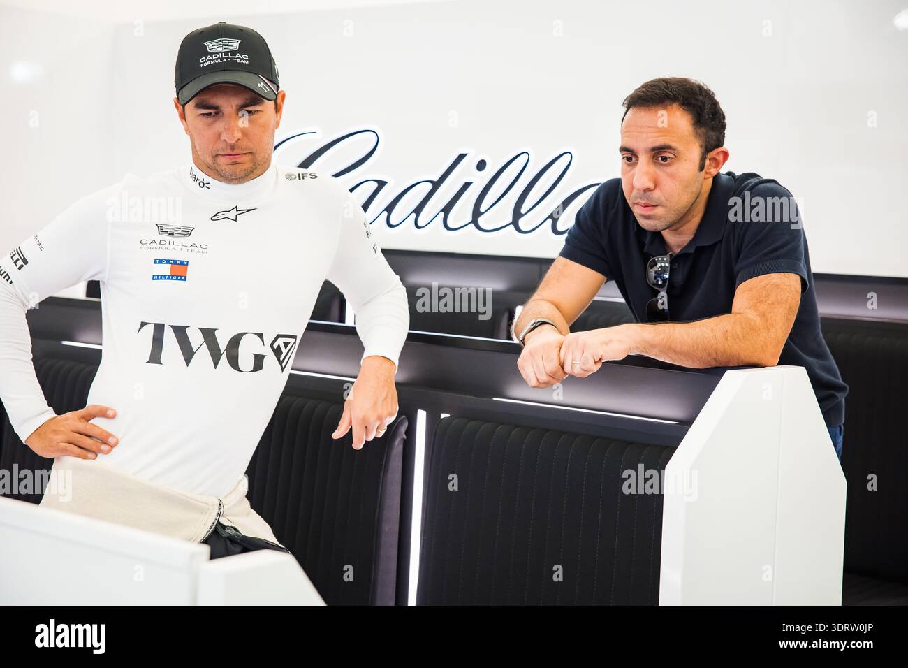 (L to R): Sergio Perez (MEX) Cadillac Formula 1 Team with Khalil ...