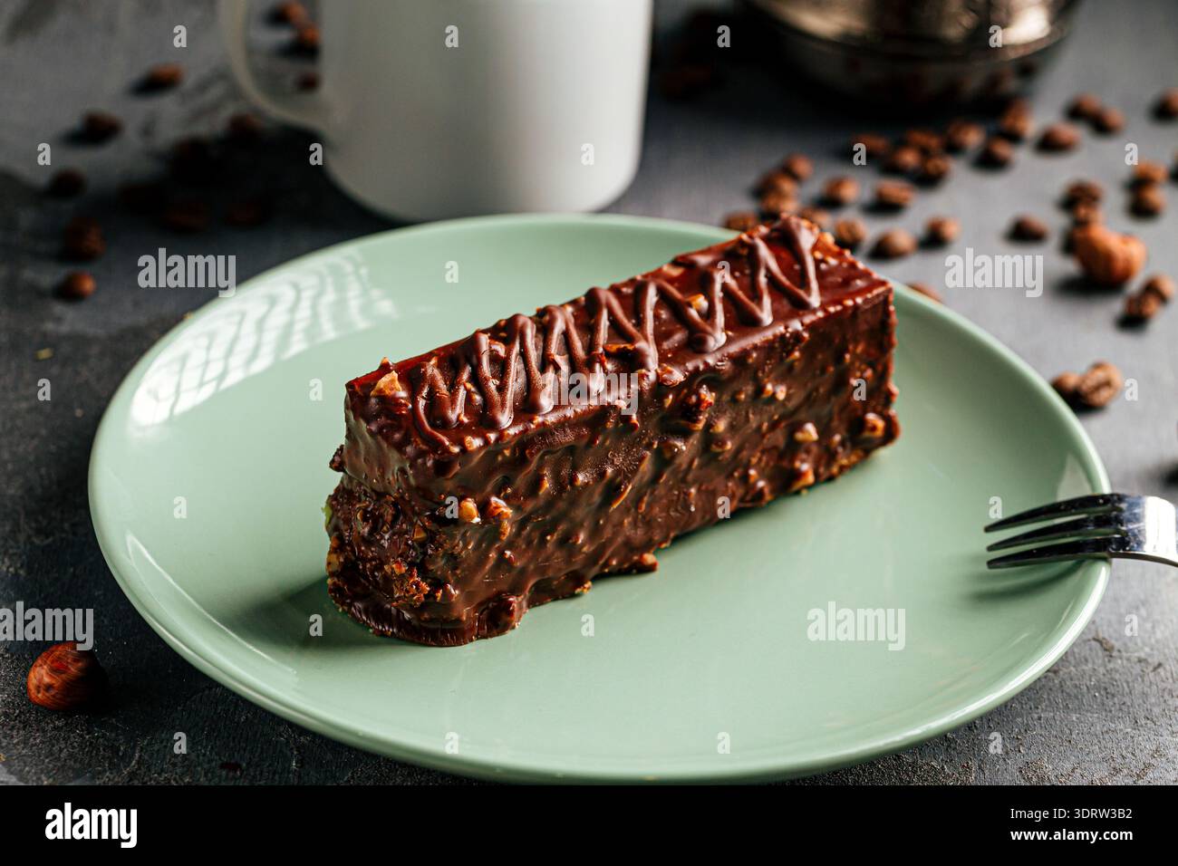 Chocolate nut cake slice with coffee cup Stock Photo