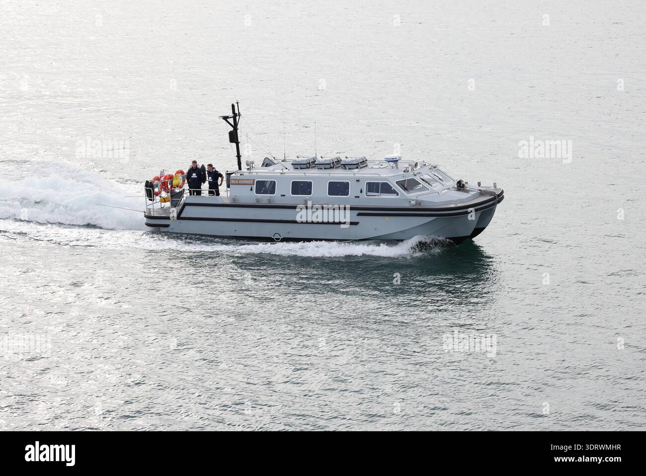 The Royal Navy passenger transport boat PTB SEA HORNET approaching the harbour Stock Photo