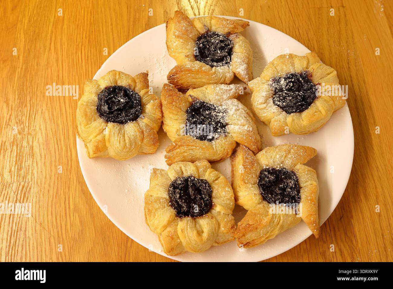Traditional Finnish Christmas cakes called Joulutorttu. Puff pastry with plum cream. Very tasty. Stock Photo