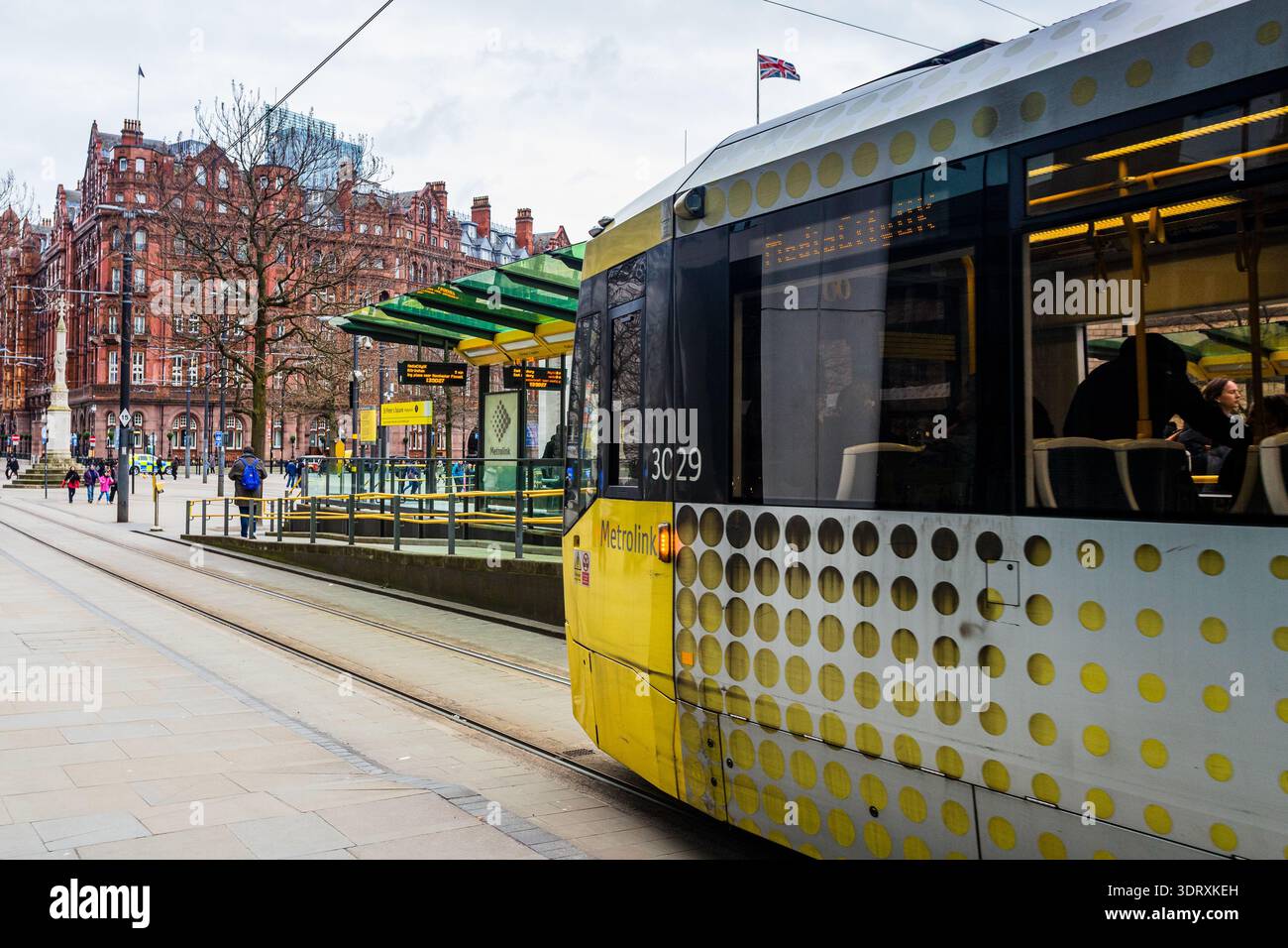 A detailed side profile of a yellow and silver Metrolink tram at a ...