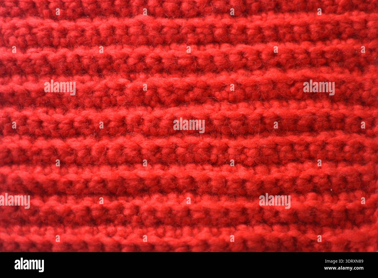 Red Crochet Fabric Texture Background – Handmade Knitted Textile Pattern Close Up Stock Photo