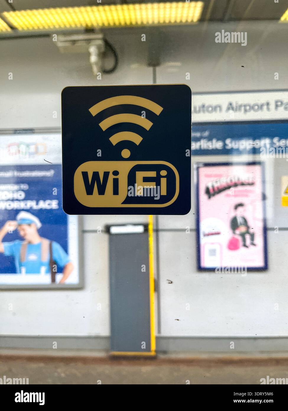 WiFi hotspot sign inside London train window public internet access sticker - Smartphone Captured Stock Image