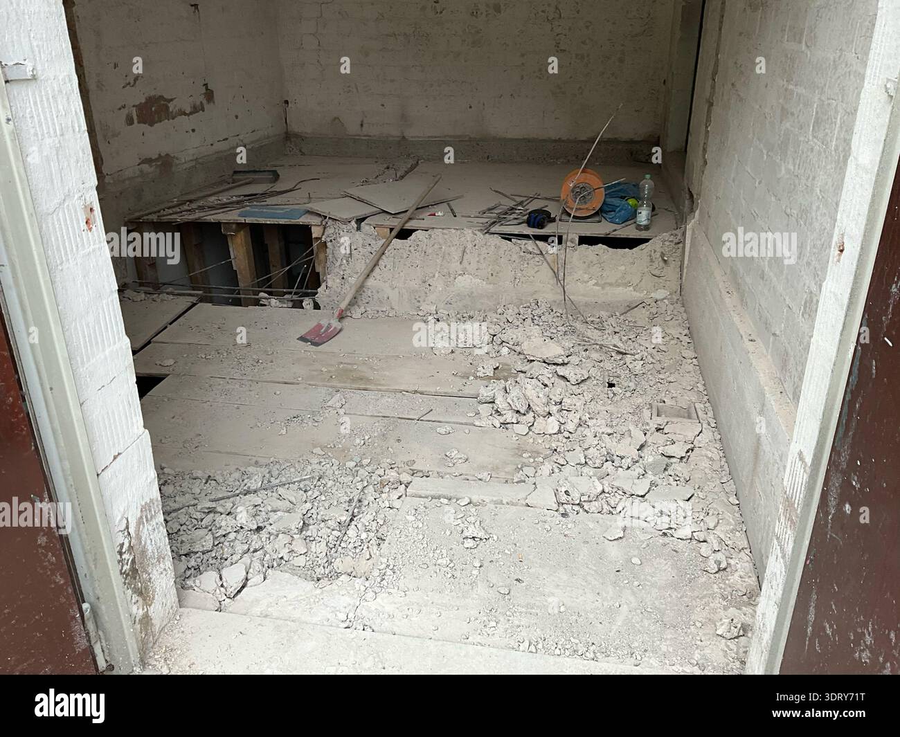 Interior demolition scene inside an unfinished building with a ...