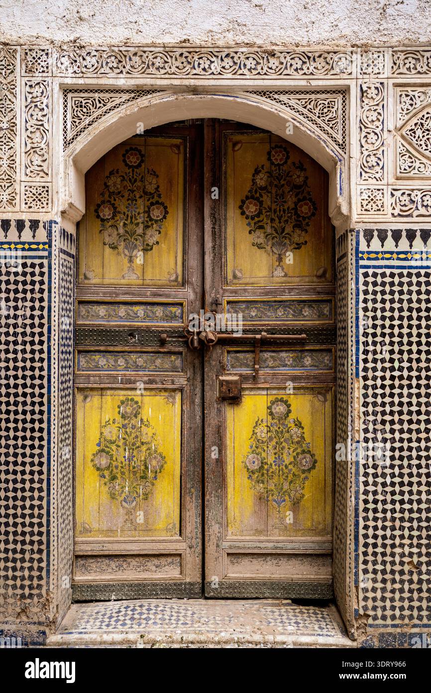 A striking detail of an ancient hand-painted wooden door with