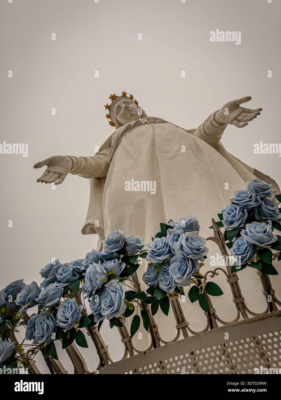Our Lady of Harissa Statue with Blue Roses, Jounieh Lebanon During Month of Mary - Smartphone Captured Stock Image