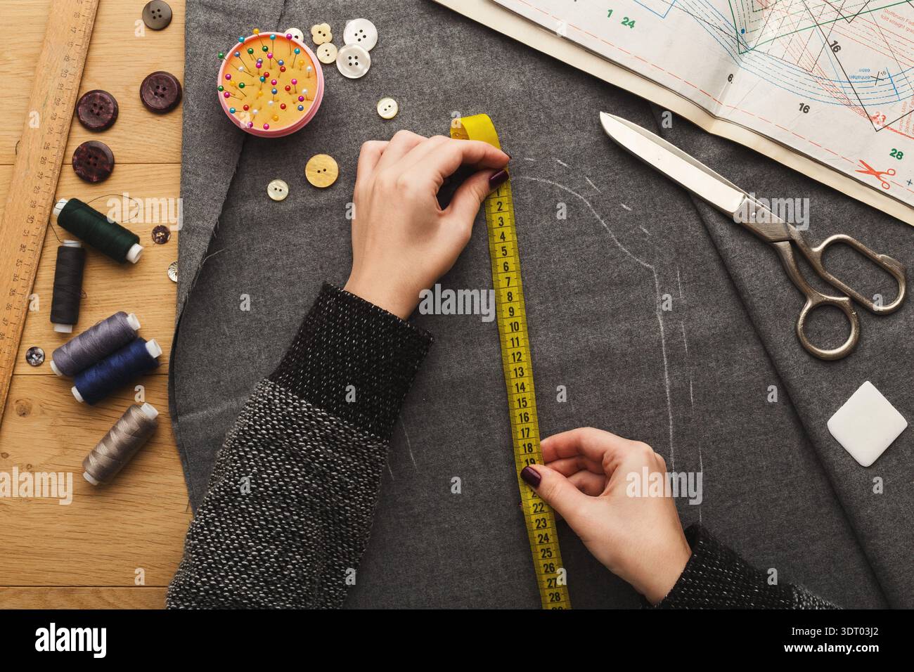 Creating a Sewing Project With Tools and Materials on a Workspace Table Stock Photo