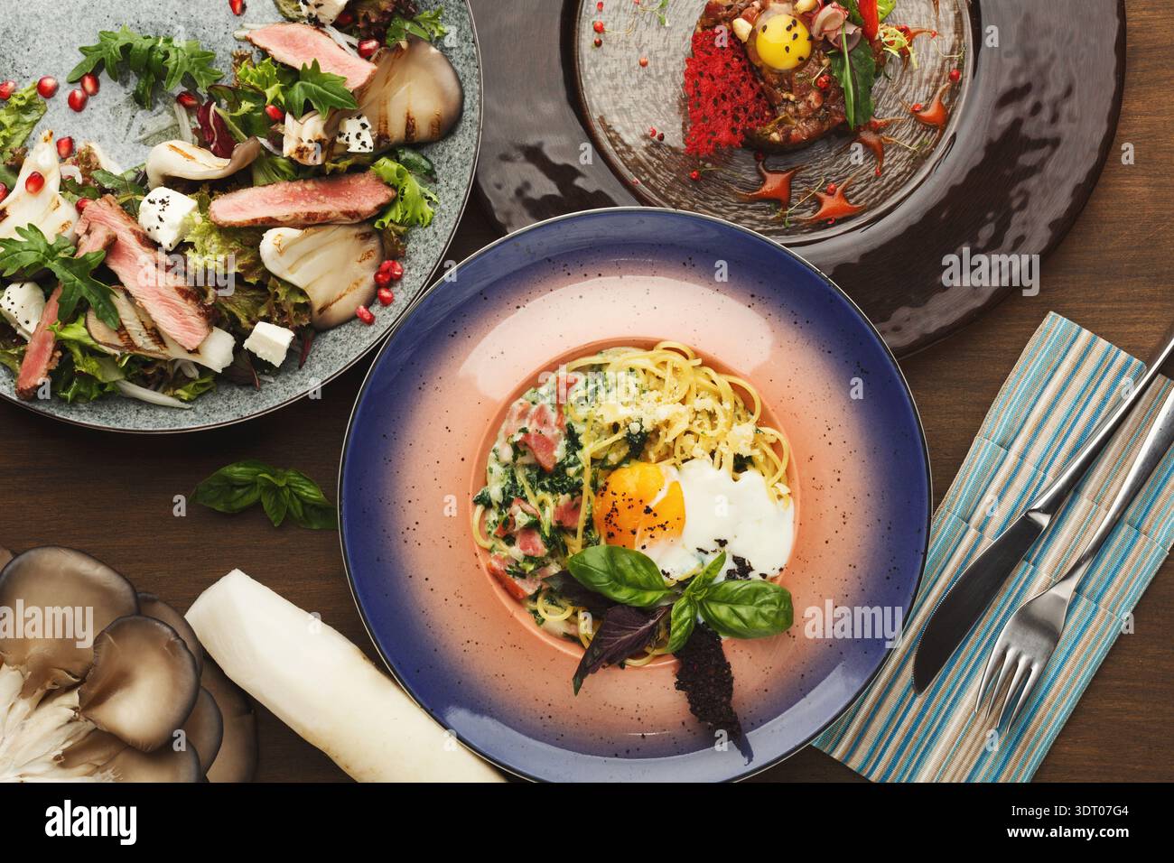 Dinner Collage With Various Dishes Showcased on Different Plates Stock Photo