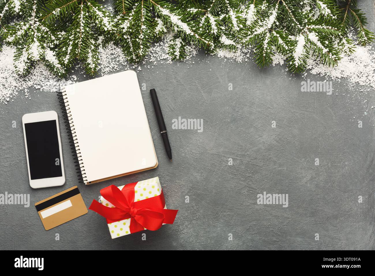 Creative Workspace Setup for Holiday Planning With Notebook and Smartphone on Grey Surface Stock Photo
