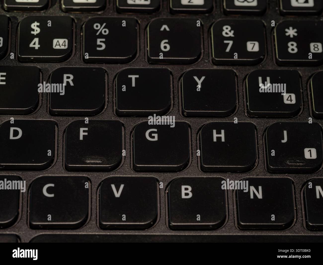 Close-up of black computer keyboard showing letter and number keys in ...