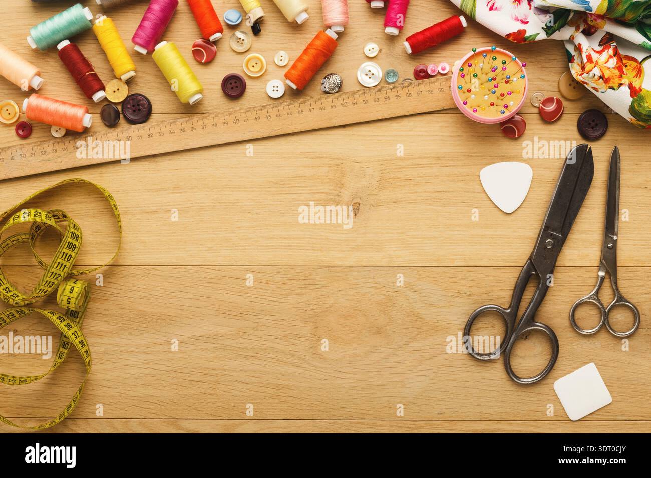 Crafting With Thread and Scissors in a Creative Space on a Wooden Table Stock Photo